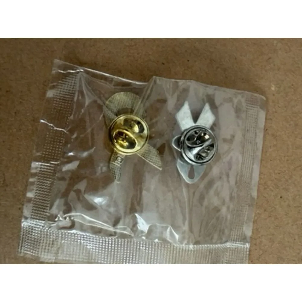 Pink Ribbon label pins one with FORD in center
